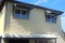 Window awnings built over the bullnose veranda, Perth - Castlegate Home Improvements also clad the walls of the house with weatherboard